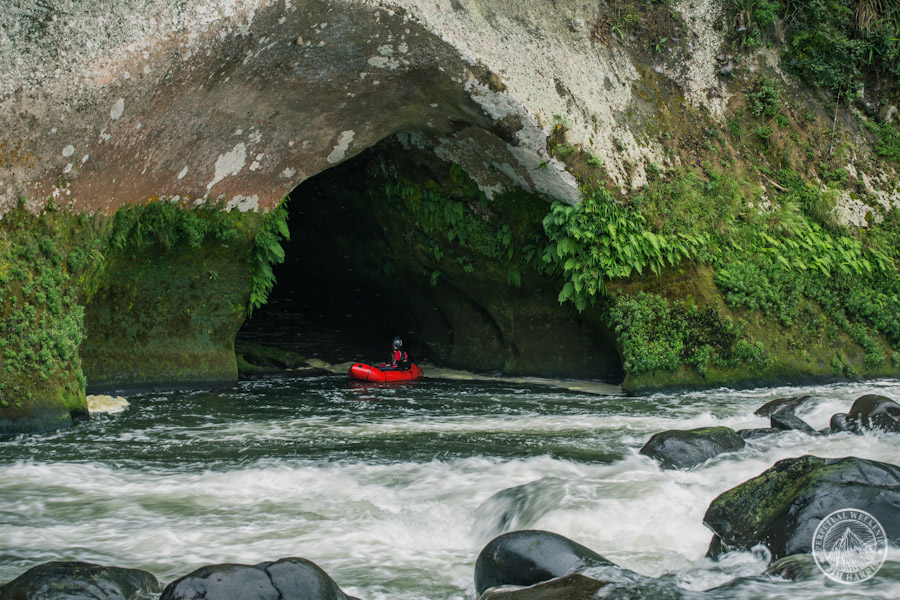 Todd Tumolo explores a cave erroded into the walls along the Rio Antigua