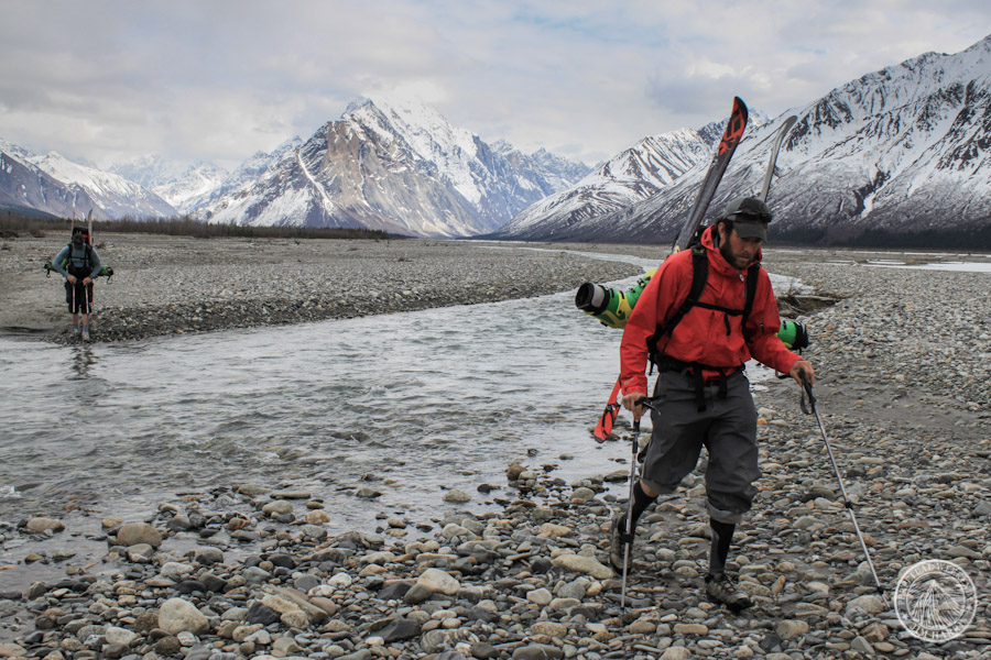Noah squelches across a braid of the Big River on the trek towards home.
