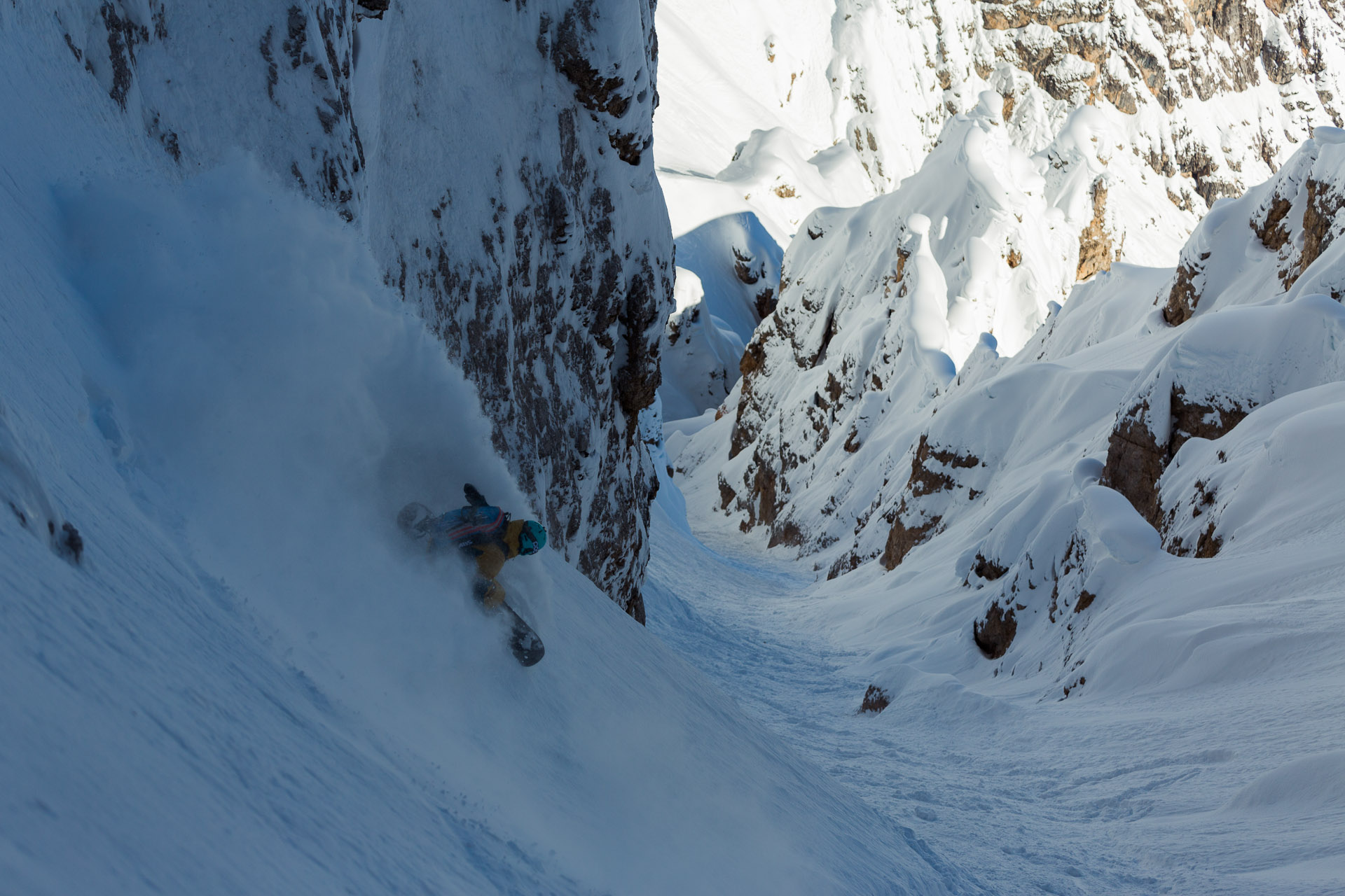 Bibi Pekarek drops in to a chute in the Dolomites