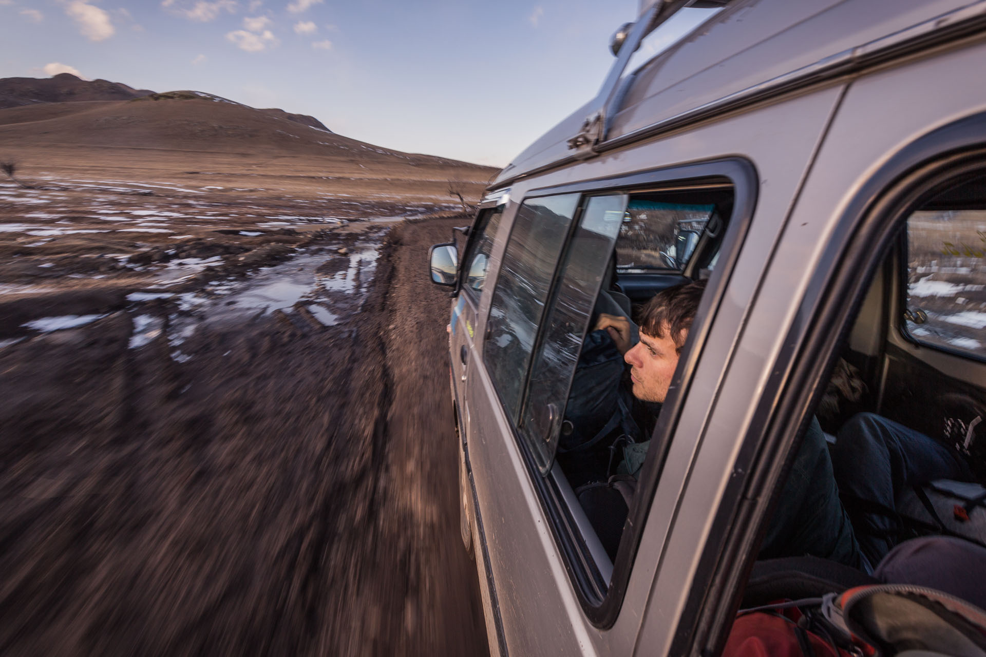 Gregg Treinish riding in a hired van on an ~18 hour drive from Ulaanbaatar to Mörön, Mongolia